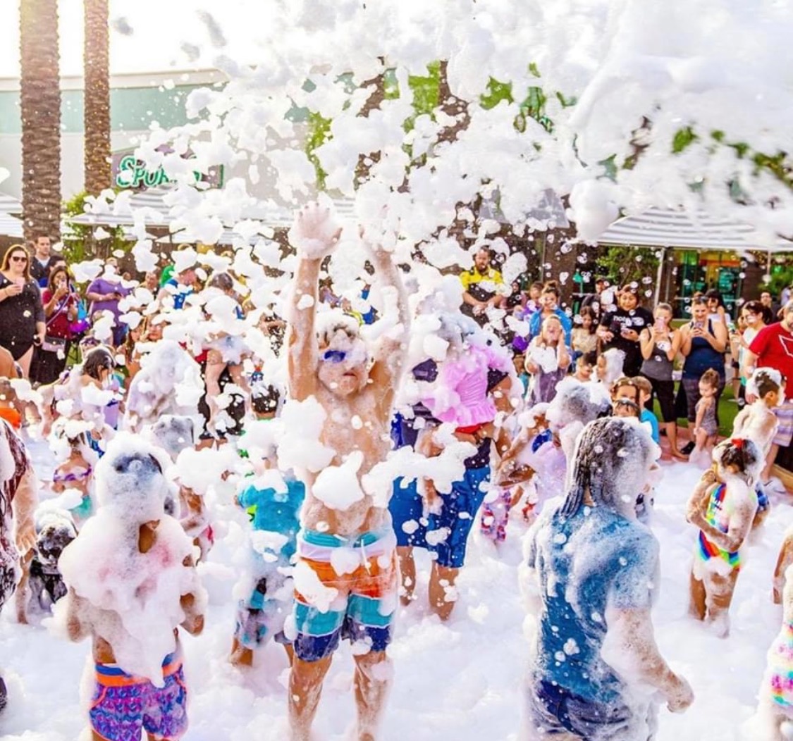 Colorado guests celebrating at a hosted Foamsational Fun foam party